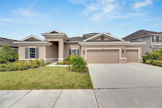 view of front of property featuring a garage and a front yard