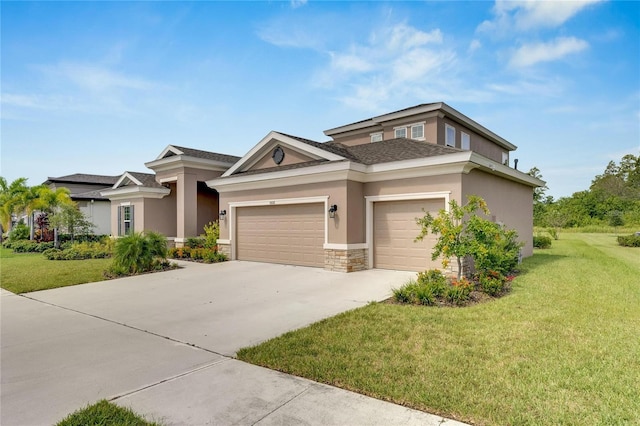 view of front facade with a garage and a front yard