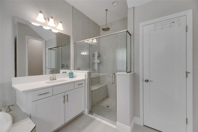 bathroom with tile patterned flooring, vanity, and separate shower and tub