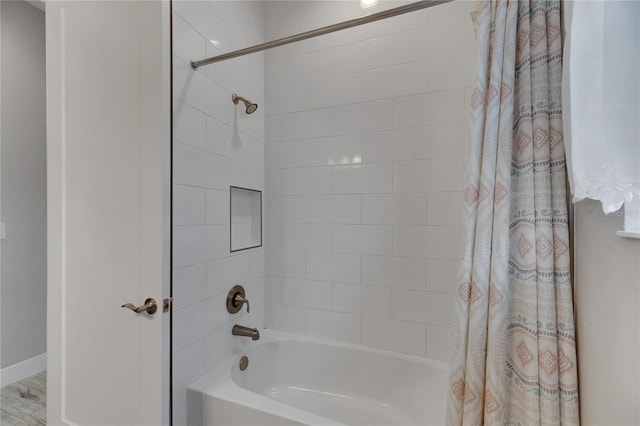 bathroom featuring shower / bath combo with shower curtain