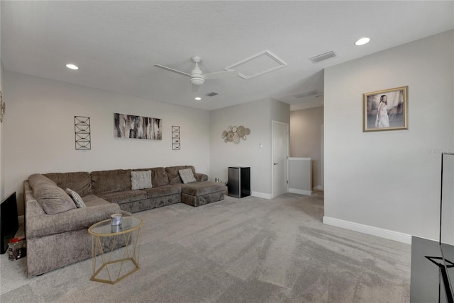 carpeted living room featuring ceiling fan