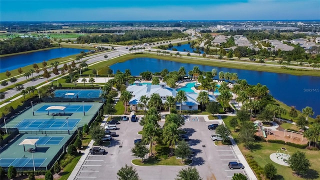 birds eye view of property with a water view