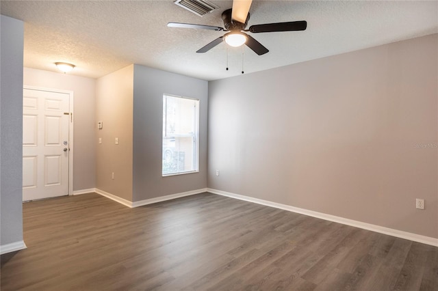 unfurnished room featuring a textured ceiling, ceiling fan, and dark hardwood / wood-style flooring