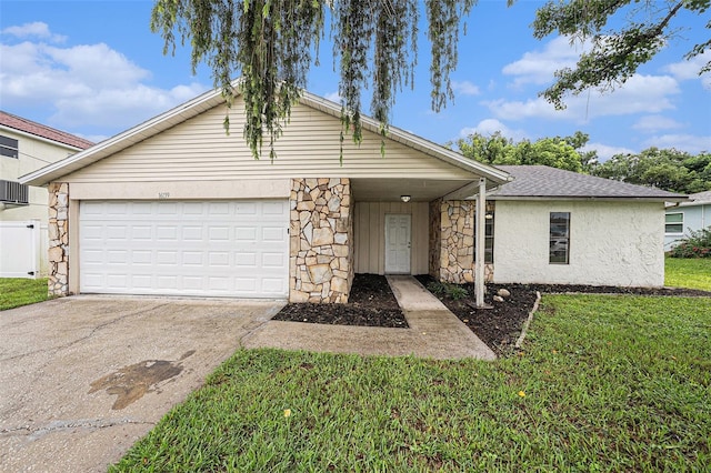 ranch-style home with a front yard and a garage