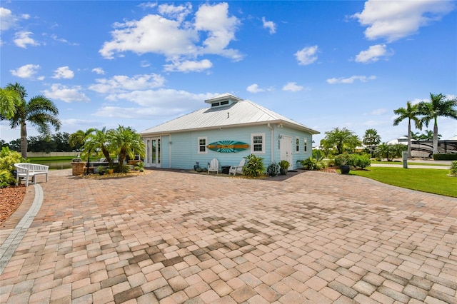 view of home's exterior featuring a lawn and a patio