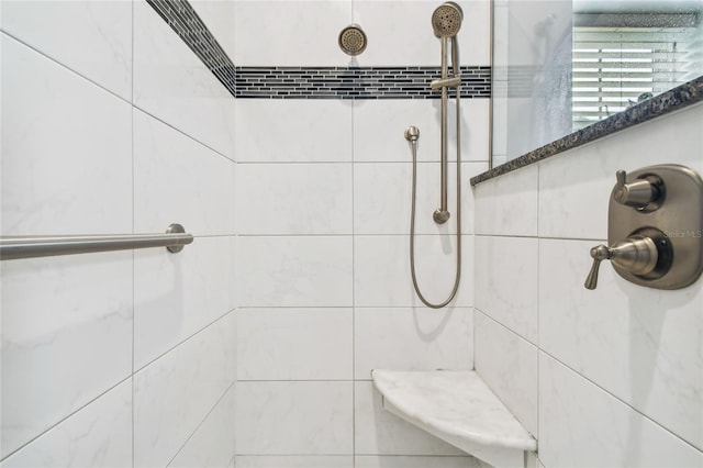 bathroom featuring tiled shower