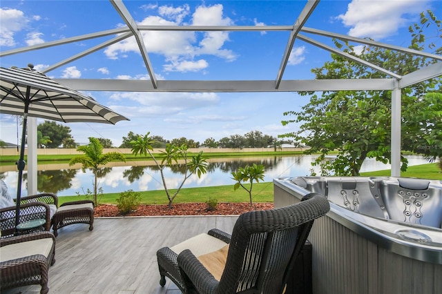 wooden terrace featuring a water view and a lanai