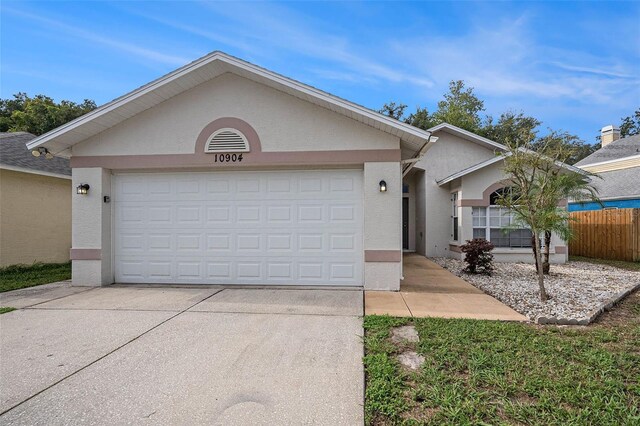 ranch-style home with a garage