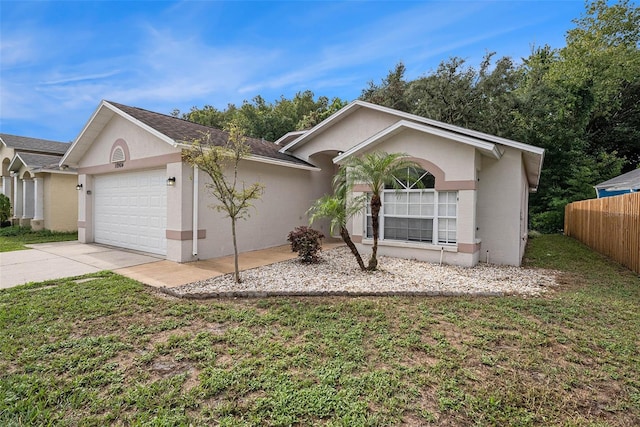 single story home with a front yard and a garage