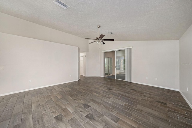 unfurnished room featuring a textured ceiling, lofted ceiling, dark wood-type flooring, and ceiling fan