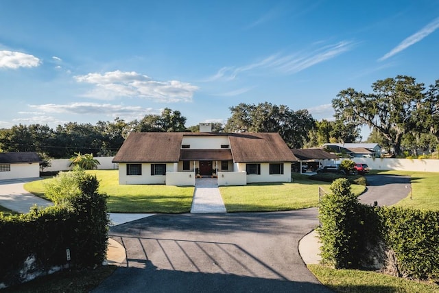 view of front of home with a front lawn