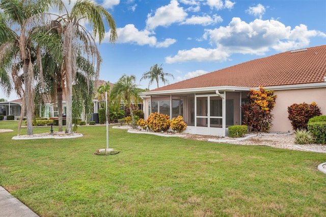 view of yard with a sunroom