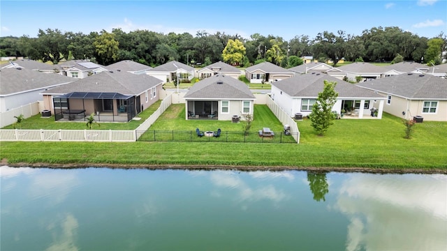 birds eye view of property with a water view