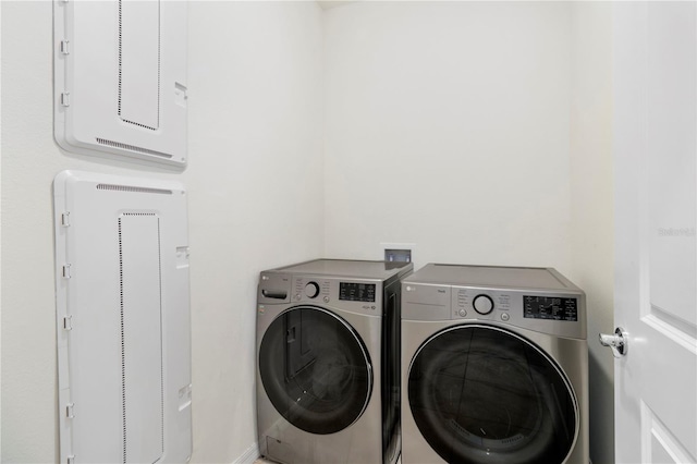 laundry area featuring washing machine and clothes dryer