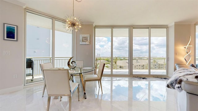 dining room with a notable chandelier, ornamental molding, and plenty of natural light