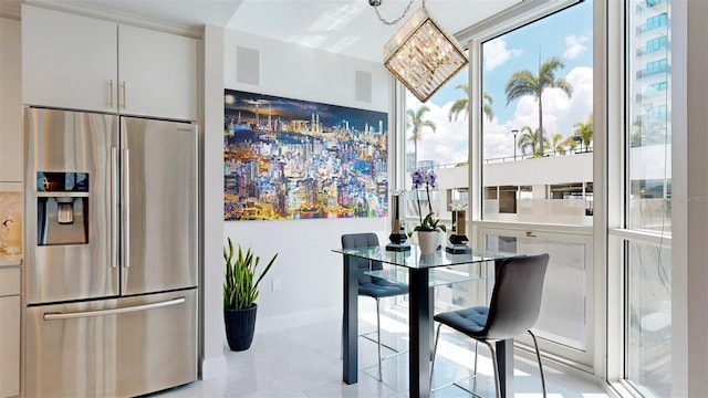 dining space featuring light tile patterned floors