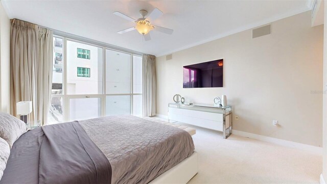 bedroom featuring light colored carpet and ceiling fan