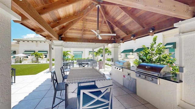 view of patio with a gazebo, exterior kitchen, a grill, and ceiling fan