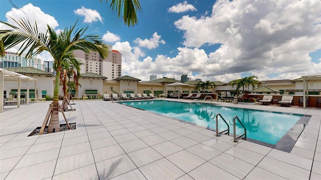 view of swimming pool featuring a patio