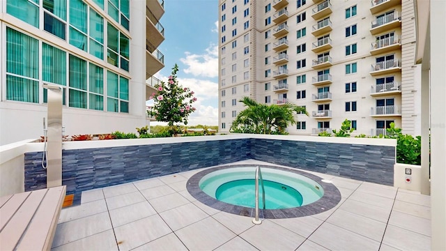 view of pool featuring a hot tub