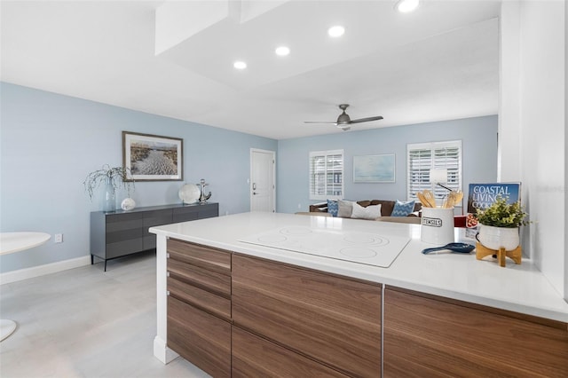 kitchen with white electric stovetop and ceiling fan