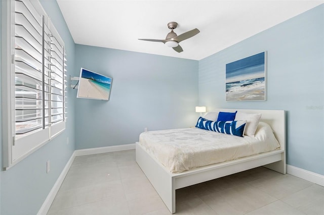 bedroom with light tile patterned floors and ceiling fan