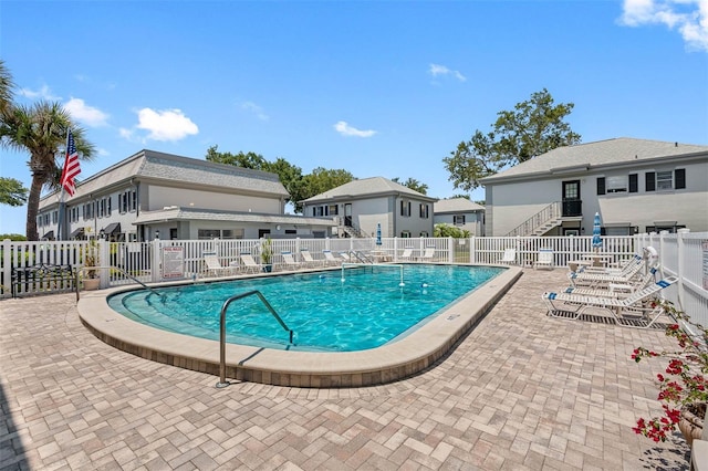 view of swimming pool featuring a patio area