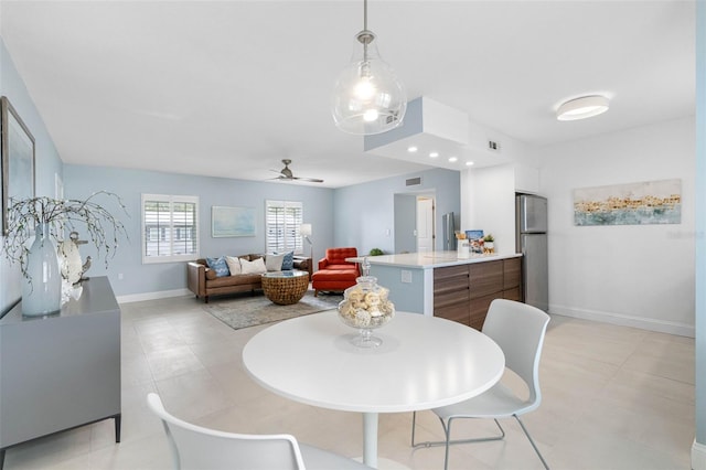 dining area with ceiling fan