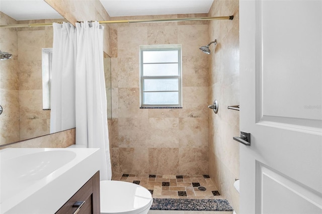 bathroom with a shower with curtain, vanity, and toilet