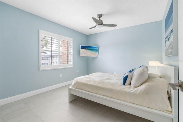 bedroom featuring baseboards and a ceiling fan