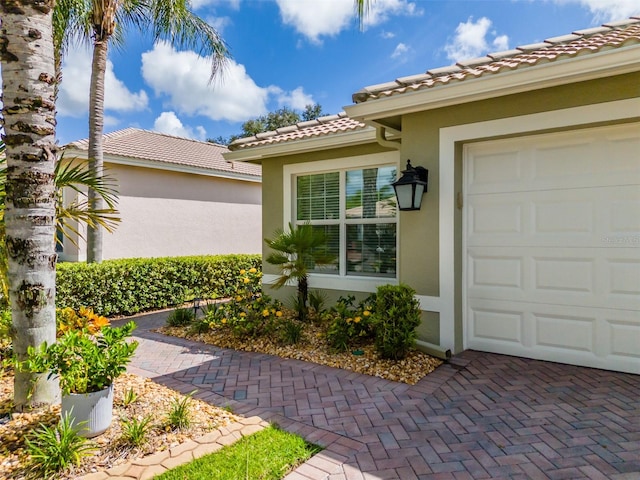 property entrance with a garage