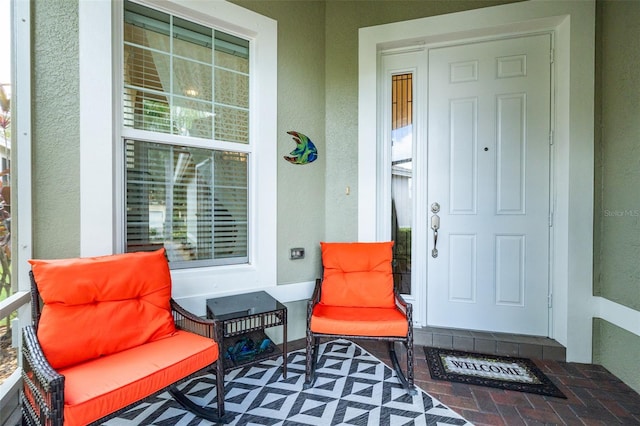 doorway to property featuring a porch