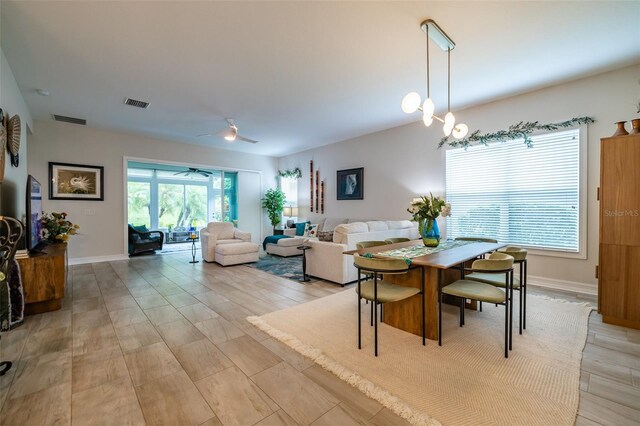 dining area featuring ceiling fan and light hardwood / wood-style floors