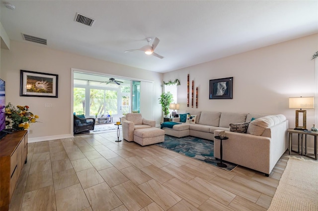 living room featuring ceiling fan