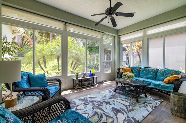 sunroom / solarium featuring ceiling fan and plenty of natural light