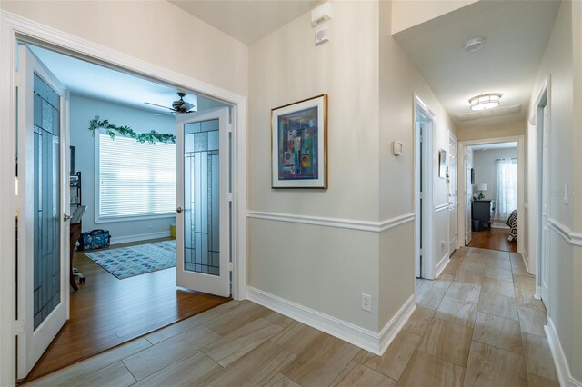 hall with light hardwood / wood-style floors