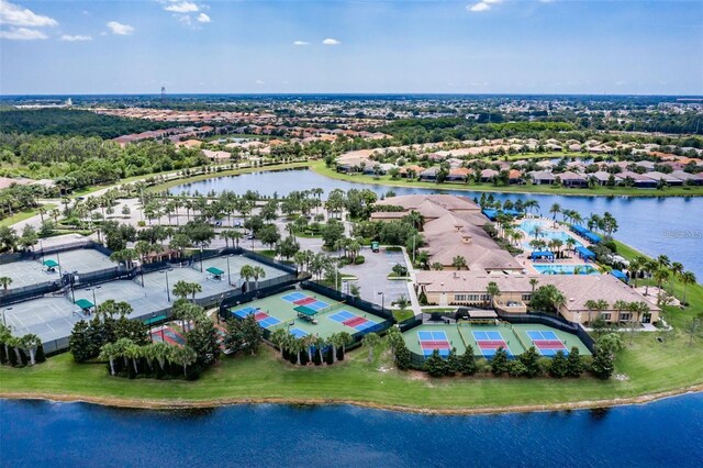 birds eye view of property with a water view