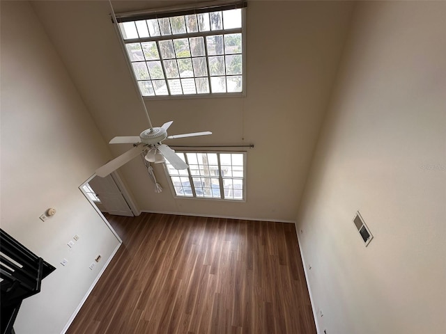 foyer featuring a high ceiling, ceiling fan, and dark hardwood / wood-style floors