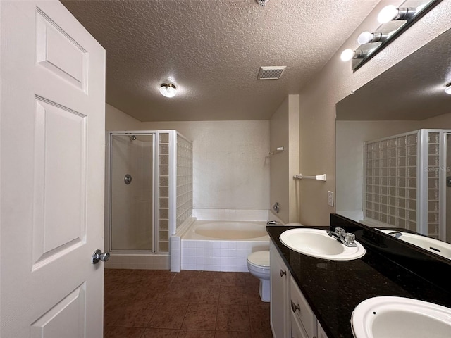 full bathroom featuring vanity, plus walk in shower, and a textured ceiling