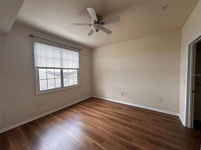 unfurnished bedroom featuring ceiling fan, dark wood-type flooring, and a textured ceiling