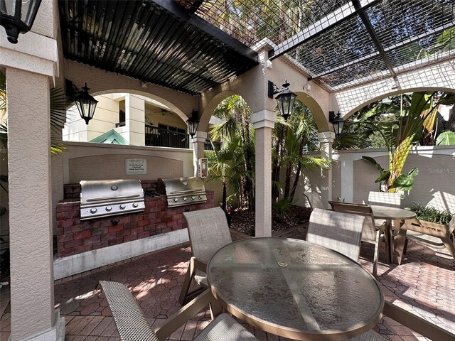 501 Knights Run Ave Unit 1327, Tampa, FL 33602 - view of patio / terrace with grilling area, outdoor dining space, and area for grilling