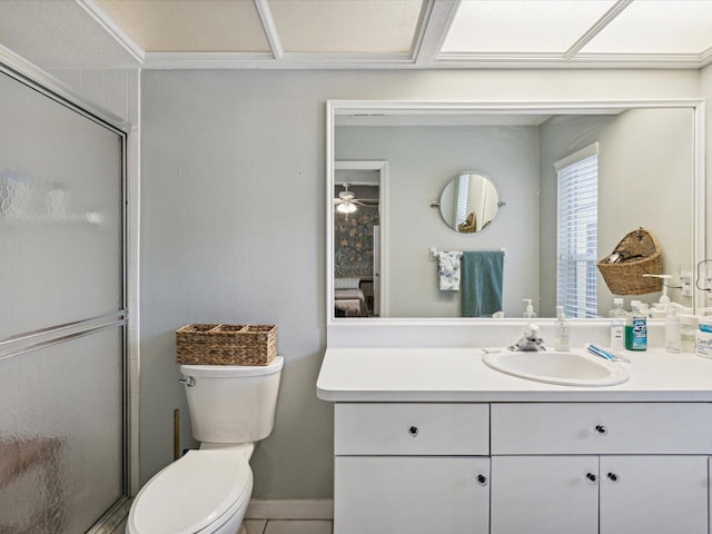 bathroom with walk in shower, tile patterned flooring, toilet, vanity, and ornamental molding