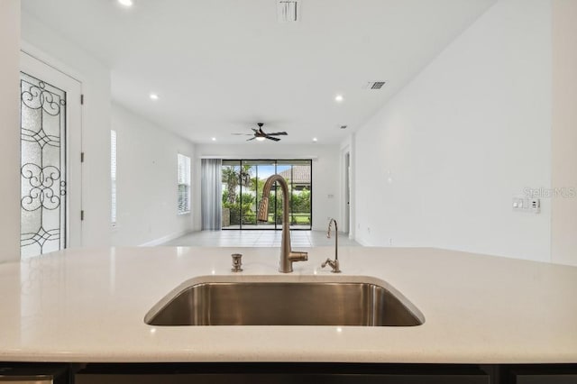 kitchen with ceiling fan and sink