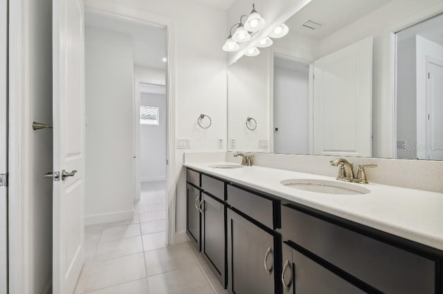 bathroom with tile patterned flooring and vanity