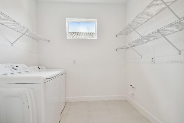 washroom with independent washer and dryer