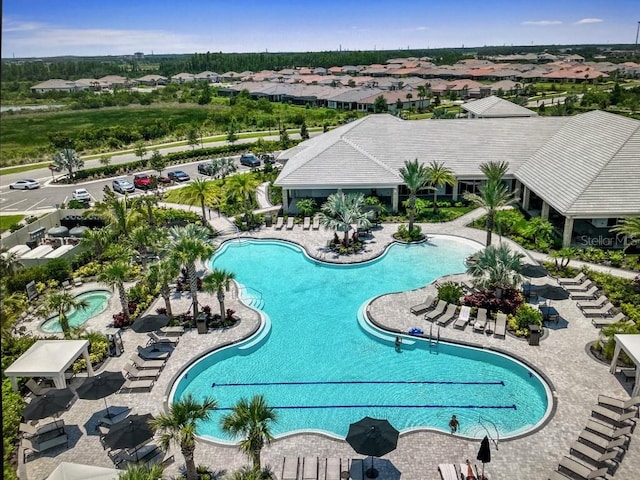 view of swimming pool with a patio