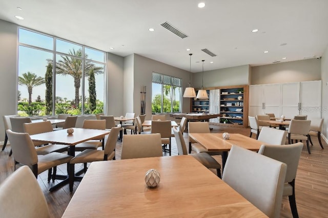 dining area with wood-type flooring