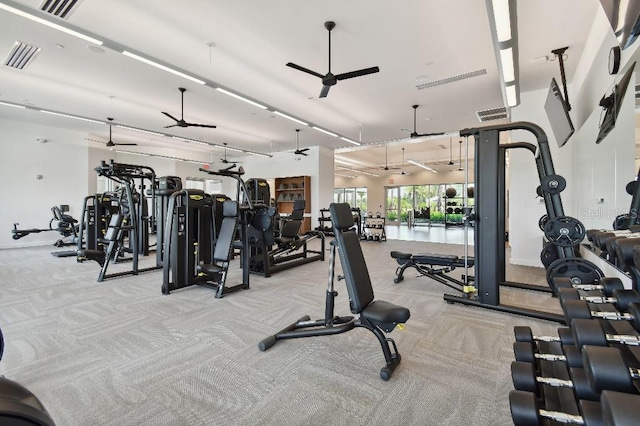 workout area featuring ceiling fan and light colored carpet