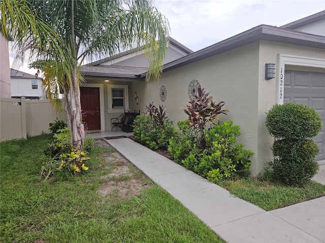 view of front facade featuring a garage and a front lawn