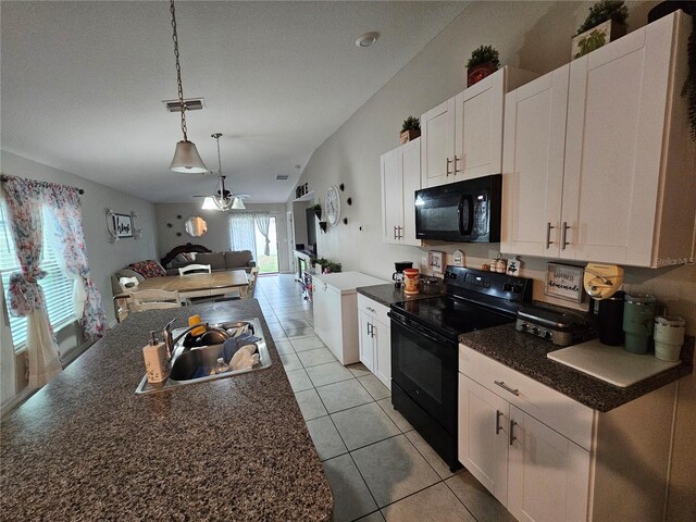 kitchen featuring white cabinets, light tile patterned floors, sink, black appliances, and pendant lighting